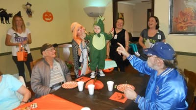Residents and staff celebrating Halloween with costumes
