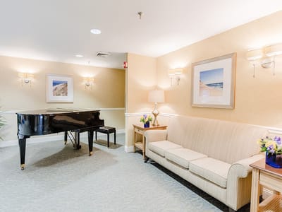 Interior common area with piano and seating