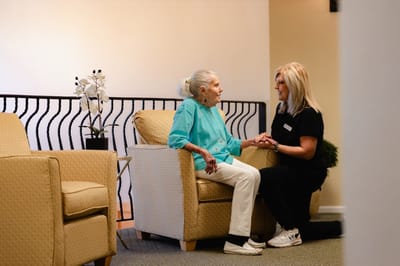 Staff member conversing with a resident in a common area