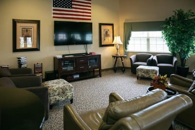 Cozy common area with seating and television