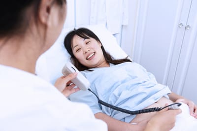 Patient receiving medical attention in a clinical environment