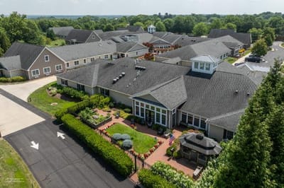 Aerial view of the senior living facility surrounded by greenery
