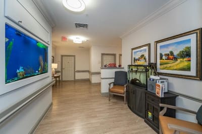 Bright interior hallway with aquarium and seating