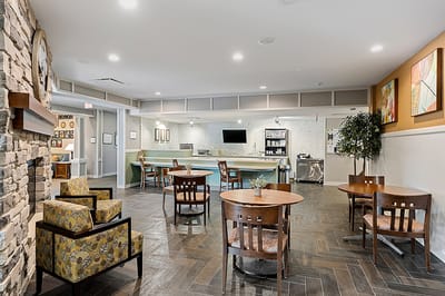 Interior view of a common area with seating and kitchenette