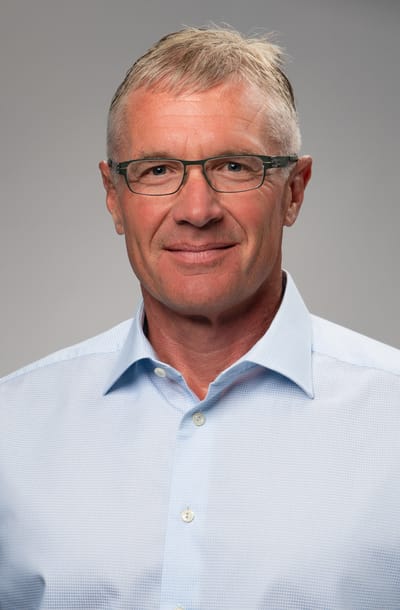 Portrait of a man in a light blue shirt