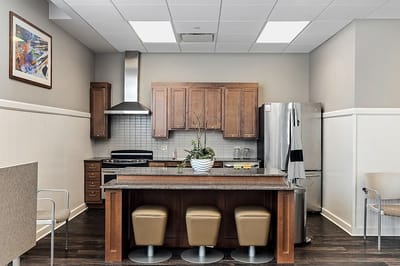 Interior view of a community kitchen area with seating