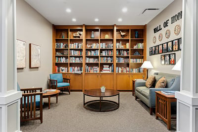 Common area with bookshelves and seating