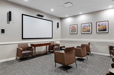 Interior view of a common area with chairs and artwork