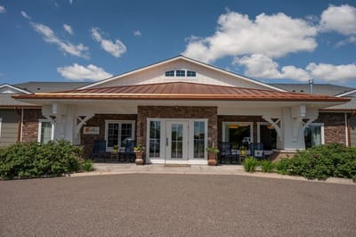 Exterior view of a senior living facility with a welcoming entrance