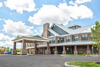 Exterior view of the assisted living facility with a covered entrance