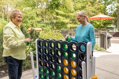Two residents enjoying a game outside