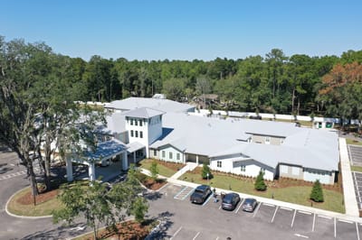Aerial view of the senior living facility with parking