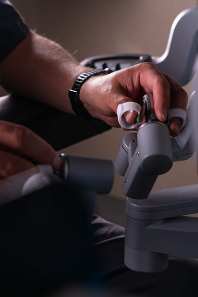 Close-up of a hand adjusting a device