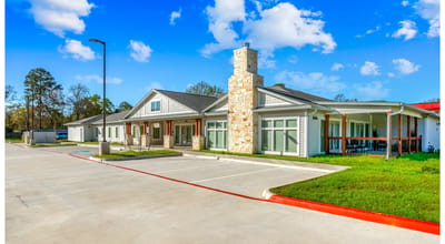 Exterior view of the assisted living facility with landscaped areas