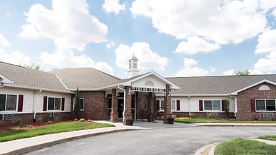 Exterior view of the facility building on a sunny day