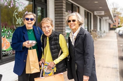Three residents enjoying a day out in a friendly community