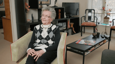 A resident sitting comfortably in a living room.
