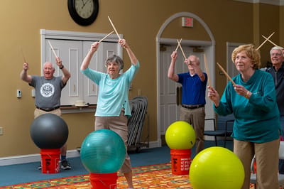 Residents participating in a group activity with exercise balls