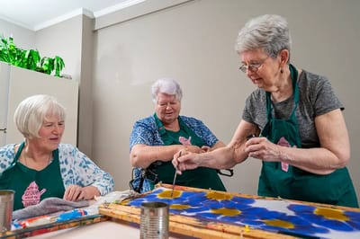 Residents engaged in a painting activity