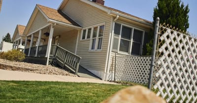 Front view of a residential building with porch