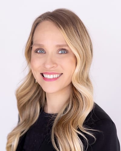 A young woman smiling with long hair