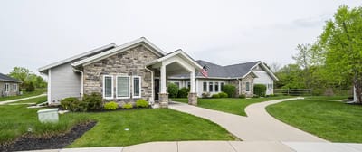 Exterior view of Otterbein Sunset House with landscaped pathways