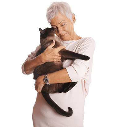 Senior woman holding a cat in a caring embrace