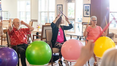 Residents participating in a vibrant activity class