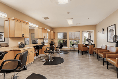 Bright salon area with styling stations and seating