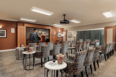 Common area with seating and decor in a senior living facility