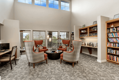 Interior common area with seating and bookshelves