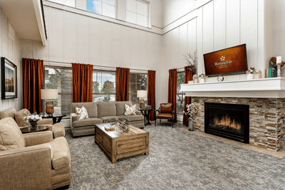 Cozy lobby area with seating and a fireplace