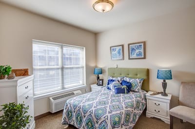 Cozy private resident room with floral bedding