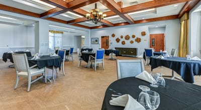 Elegant dining area with tables set for meal service