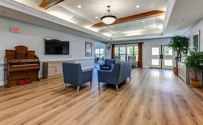 Bright common area with comfortable seating and natural light