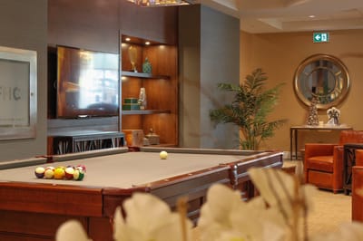 Interior view of a common area with a pool table