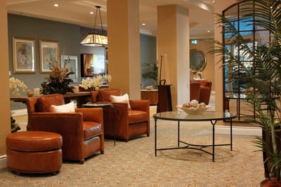 Cozy lobby area with leather chairs and decor