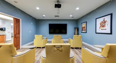 Interior of a common area with yellow chairs