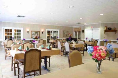 Bright dining room with tables set for meals
