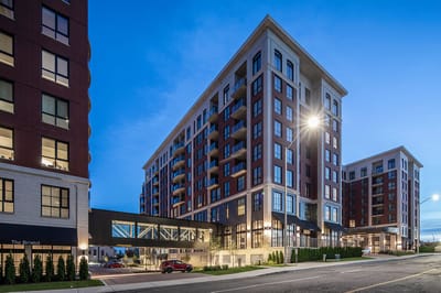 Exterior view of Waterford Grand Retirement Community at dusk
