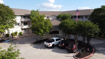 Aerial view of the parking area and entrance of the facility