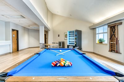 Interior view of a common area with a pool table