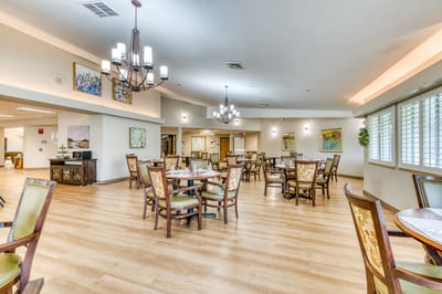 Bright dining area with tables and chairs
