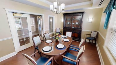Dining area set with table and chairs in facility