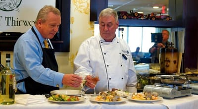 Staff serving gourmet meals in a dining area