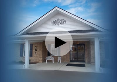 Entrance of Pleasant Meadows Assisted Living with signage