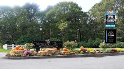 Exterior sign with autumn decorations at Thirwood Place