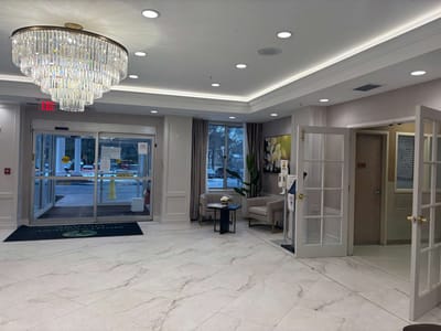 Interior lobby area with chandelier and seating