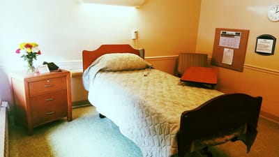 Private resident room with a bed and furnishings