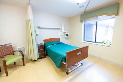 Private resident room with a bed and window